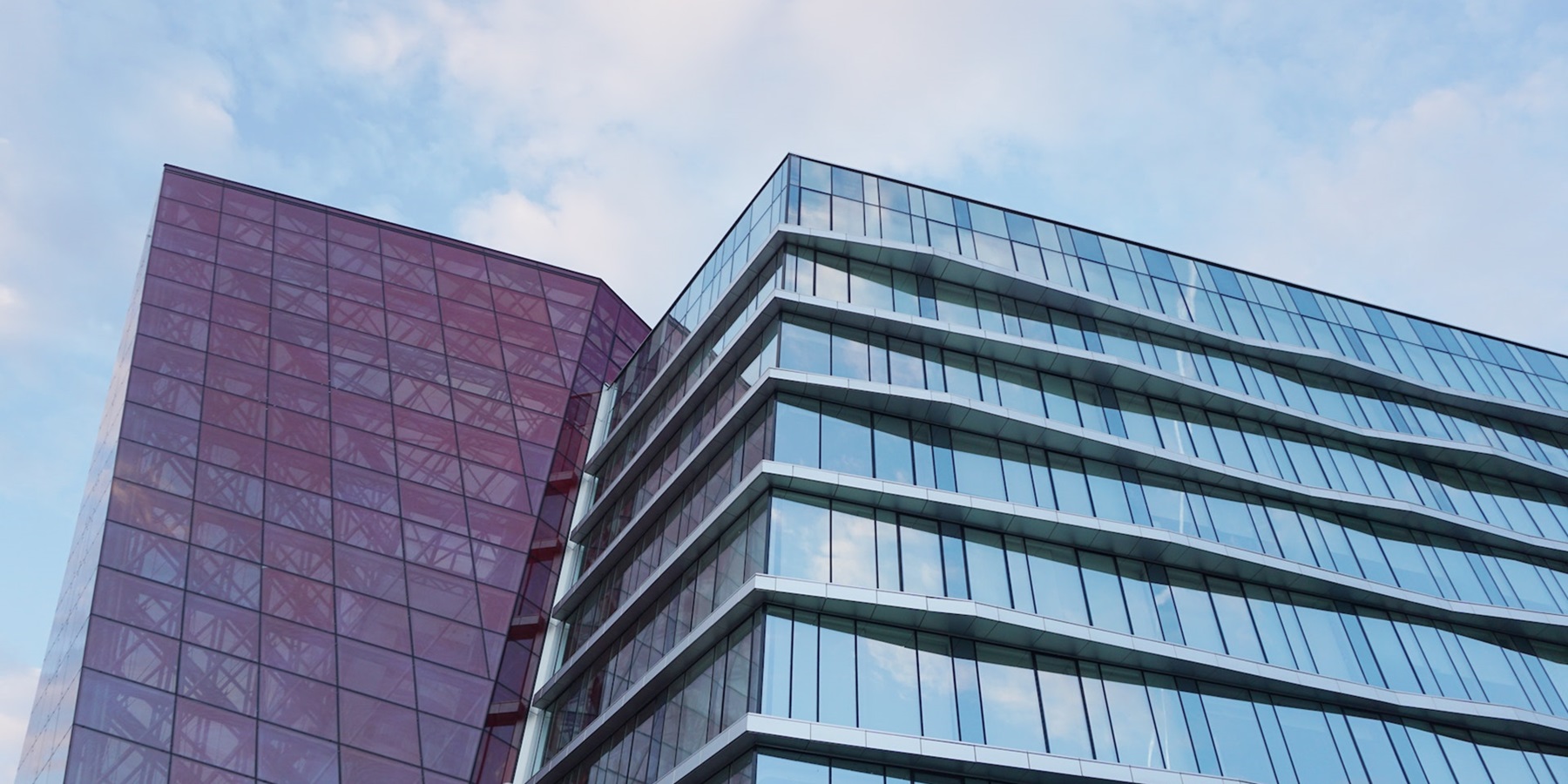 Two employees standing in front of their coffee shop